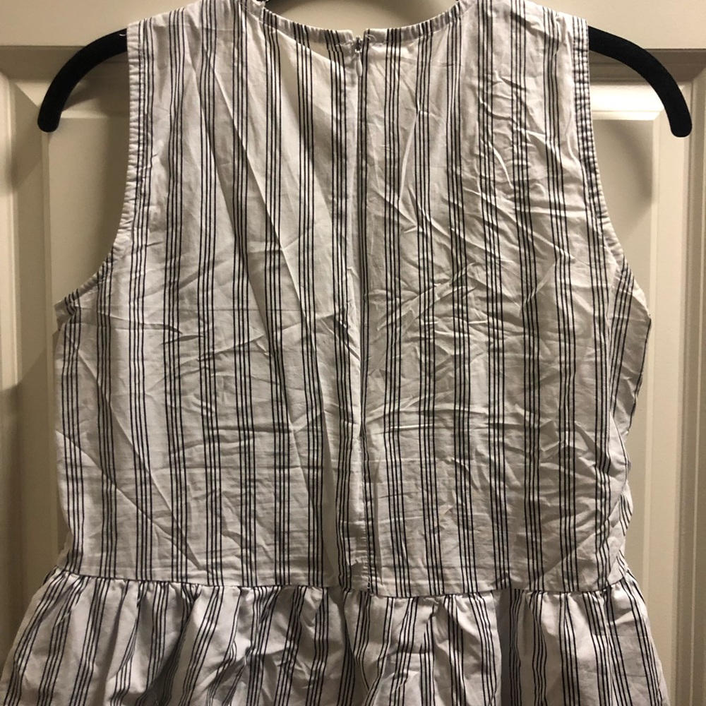 Black/white striped shirt with ruffle bottom